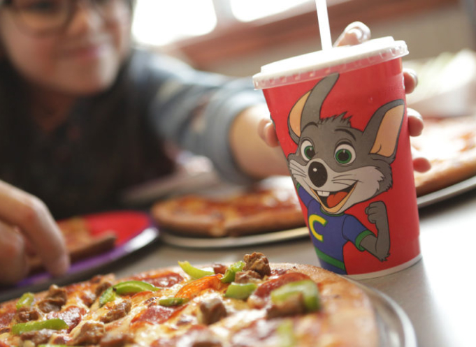 Pizza with Chucky E. Cheese drink